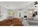 Open-concept living area with hardwood floors, fireplace, and a breakfast area at 858 Red Rock Ct, Suwanee, GA 30024