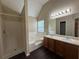 Bright bathroom with double vanity, soaking tub, walk-in shower, and ample cabinet space at 330 Kentwood Springs Dr, Hampton, GA 30228
