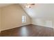 Bedroom with vaulted ceilings, ceiling fan, wood-look flooring, and a window at 330 Kentwood Springs Dr, Hampton, GA 30228