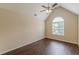 Bedroom with wood floors, vaulted ceiling, and a large window at 330 Kentwood Springs Dr, Hampton, GA 30228