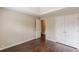 The primary bedroom has hardwood floors, a trey ceiling, closet, and an ensuite at 330 Kentwood Springs Dr, Hampton, GA 30228