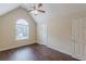 Bedroom boasting wood-look floors, and a large window providing ample natural light at 330 Kentwood Springs Dr, Hampton, GA 30228