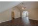 A large bedroom with vaulted ceilings, wood-look floors and a ceiling fan at 330 Kentwood Springs Dr, Hampton, GA 30228