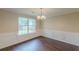 Cozy dining room featuring hardwood floors and wainscoting at 330 Kentwood Springs Dr, Hampton, GA 30228