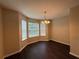 Charming dining area with large windows, allowing plenty of natural light, and a decorative light fixture at 330 Kentwood Springs Dr, Hampton, GA 30228