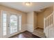 Foyer with hardwood floors, stairs and decorative front door at 330 Kentwood Springs Dr, Hampton, GA 30228