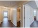Hallway boasting wood-look floors and a clear view to multiple bathrooms and bedrooms at 330 Kentwood Springs Dr, Hampton, GA 30228