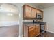 Well-equipped kitchen with wood cabinetry, stainless steel appliances, and dark countertops at 330 Kentwood Springs Dr, Hampton, GA 30228