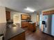 Well-equipped kitchen with wood cabinets, stainless steel appliances, granite counters, and a center island at 330 Kentwood Springs Dr, Hampton, GA 30228