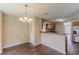 An open kitchen and dining area with stainless steel refrigerator and plenty of natural light at 330 Kentwood Springs Dr, Hampton, GA 30228