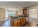 The kitchen features wooden cabinets, stainless steel appliances, and an adjacent dining area at 330 Kentwood Springs Dr, Hampton, GA 30228