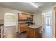 Open kitchen featuring wooden cabinets, stainless steel microwave and stove, and tiled backsplash at 330 Kentwood Springs Dr, Hampton, GA 30228