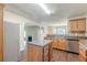 Open-concept kitchen with stainless steel appliances and kitchen island at 330 Kentwood Springs Dr, Hampton, GA 30228