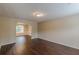Spacious living room with hardwood floors and archway leading to dining area at 330 Kentwood Springs Dr, Hampton, GA 30228