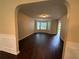Spacious living room with beautiful hardwood floors, neutral paint, and a large bay window with natural light at 330 Kentwood Springs Dr, Hampton, GA 30228
