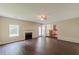 The living room includes a fireplace, wood flooring, and access to the kitchen area at 330 Kentwood Springs Dr, Hampton, GA 30228
