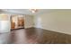 Spacious living room featuring an open floor plan and access to the kitchen area at 330 Kentwood Springs Dr, Hampton, GA 30228