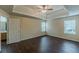 Main bedroom featuring wood-look floors, dual windows and a ceiling fan at 330 Kentwood Springs Dr, Hampton, GA 30228