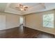 Main bedroom boasting wood-look floors, a ceiling fan and neutral walls at 330 Kentwood Springs Dr, Hampton, GA 30228