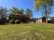 Spacious backyard with mature trees and greenery, perfect for outdoor enjoyment at 4506 Town Crier Sw Rd, Lilburn, GA 30047