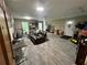Spacious basement with carpet tiles, a leather chair, and abundant natural light at 4506 Town Crier Sw Rd, Lilburn, GA 30047