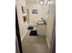 A cozy bathroom with modern gray floors, clean lines, and a shower-tub combo at 4506 Town Crier Sw Rd, Lilburn, GA 30047