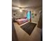 Cozy bedroom featuring decor, carpeted floors, and a ceiling fan at 4506 Town Crier Sw Rd, Lilburn, GA 30047