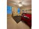 Bedroom featuring a ceiling fan, dresser, bed and natural light at 4506 Town Crier Sw Rd, Lilburn, GA 30047
