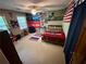 Bedroom with vibrant decor, guitar, beanbag chair, and a cozy rug at 4506 Town Crier Sw Rd, Lilburn, GA 30047