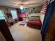 Spacious bedroom featuring unique decor, ceiling fan, and natural light at 4506 Town Crier Sw Rd, Lilburn, GA 30047