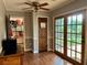 Dining area with wooden floors and french doors at 4506 Town Crier Sw Rd, Lilburn, GA 30047