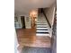 Foyer with hardwood floors and staircase at 4506 Town Crier Sw Rd, Lilburn, GA 30047