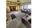 Bright living room featuring a stone fireplace, beamed ceilings, and lots of sunlight at 4506 Town Crier Sw Rd, Lilburn, GA 30047