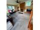 Spacious living area featuring a stone fireplace and bright, airy windows at 4506 Town Crier Sw Rd, Lilburn, GA 30047