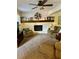 Living room with a stone fireplace and neutral-toned furniture at 4506 Town Crier Sw Rd, Lilburn, GA 30047