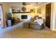 Cozy living room with fireplace, carpeted floors, and comfortable seating at 4506 Town Crier Sw Rd, Lilburn, GA 30047
