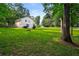 Expansive lawn extends from the house to the street in the backyard of this well maintained home at 5290 River Mill Cir, Marietta, GA 30068