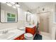 Bathroom featuring double sinks, orange cabinets, tile flooring, and shower at 5290 River Mill Cir, Marietta, GA 30068
