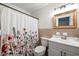 Bathroom featuring floral shower curtain, modern sink and vanity at 5290 River Mill Cir, Marietta, GA 30068