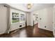 Dining room with hardwood floors, neutral curtains, and views to the outdoors at 5290 River Mill Cir, Marietta, GA 30068