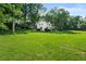 Charming home with a lush, sprawling green lawn and mature trees providing ample shade at 5290 River Mill Cir, Marietta, GA 30068