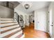 Inviting foyer with hardwood floors, elegant staircase, and a stylish light fixture at 5290 River Mill Cir, Marietta, GA 30068
