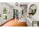 Bright foyer with hardwood floors, staircase, console table and decor at 5290 River Mill Cir, Marietta, GA 30068