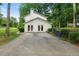 Attached garage with double doors and a private driveway, offering convenient parking at 5290 River Mill Cir, Marietta, GA 30068