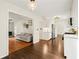 Open floor plan showcasing the kitchen with adjacent living area and hardwood flooring at 5290 River Mill Cir, Marietta, GA 30068