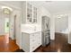 Hallway with storage, white cabinets, and stainless steel refrigerator at 5290 River Mill Cir, Marietta, GA 30068