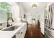Spacious kitchen featuring white cabinetry, stainless steel appliances, and natural light at 5290 River Mill Cir, Marietta, GA 30068