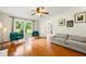 Cozy living room showcases hardwood floors, neutral paint, modern furniture, and a sun-filled window at 5290 River Mill Cir, Marietta, GA 30068