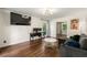Comfortable living room featuring modern lighting, stylish decor, and dark laminate flooring at 5290 River Mill Cir, Marietta, GA 30068