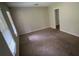 This bedroom features neutral walls, carpet flooring, and ample natural light at 5924 Central Church Rd, Douglasville, GA 30135